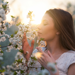 Beautiful women smelling scent.