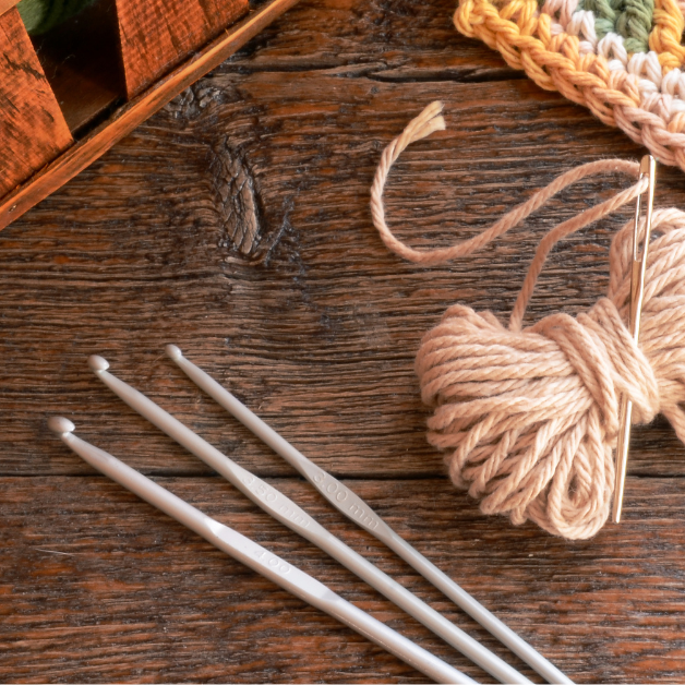 Crochet hook and wool.