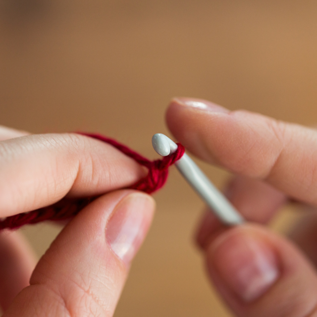 Knitting with crochet hooks.