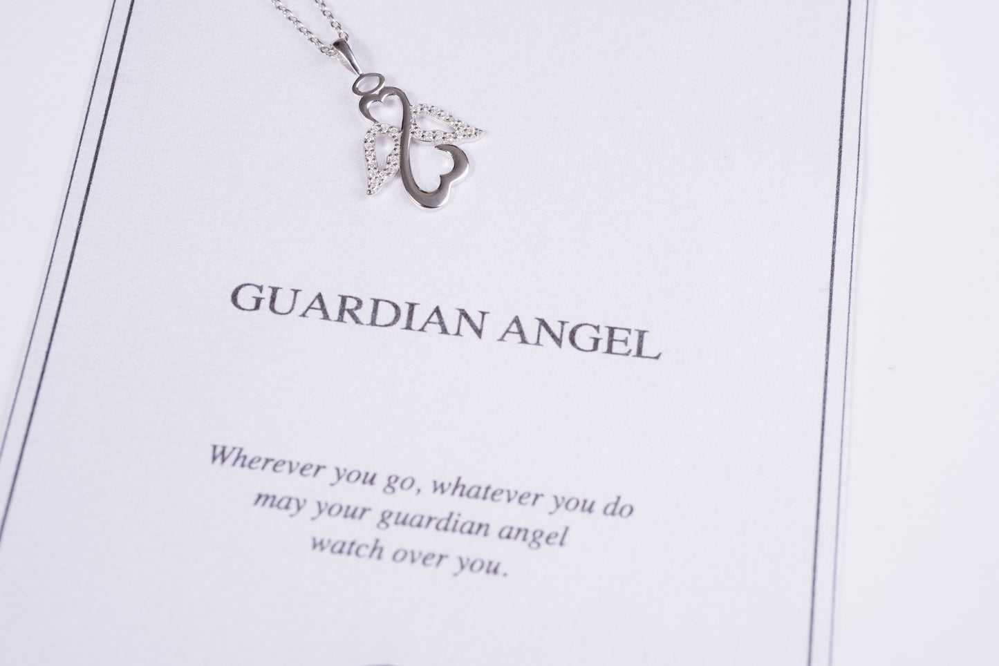 Silver guardian angel necklace.