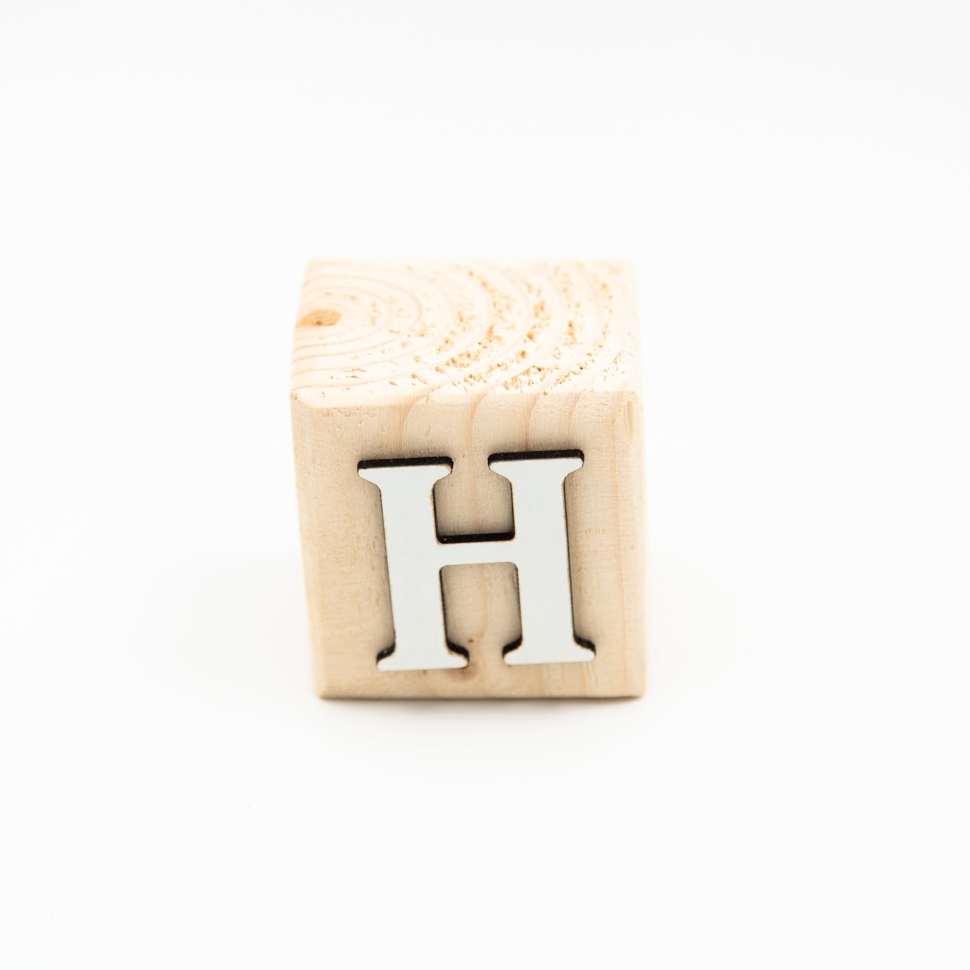 Wooden alphabet letter block H.